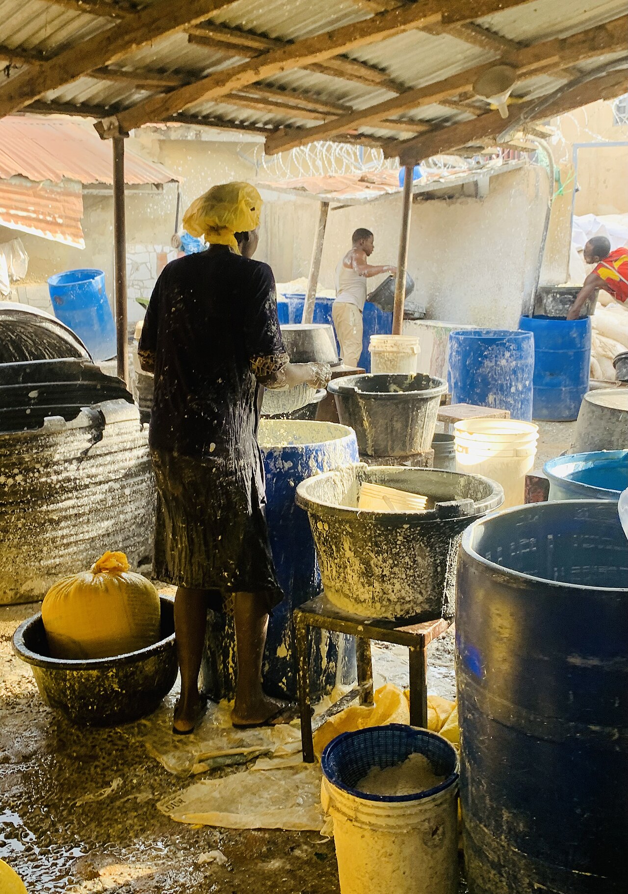 Nigerian food innovators and agribusiness partners collaborating at an industrial facility