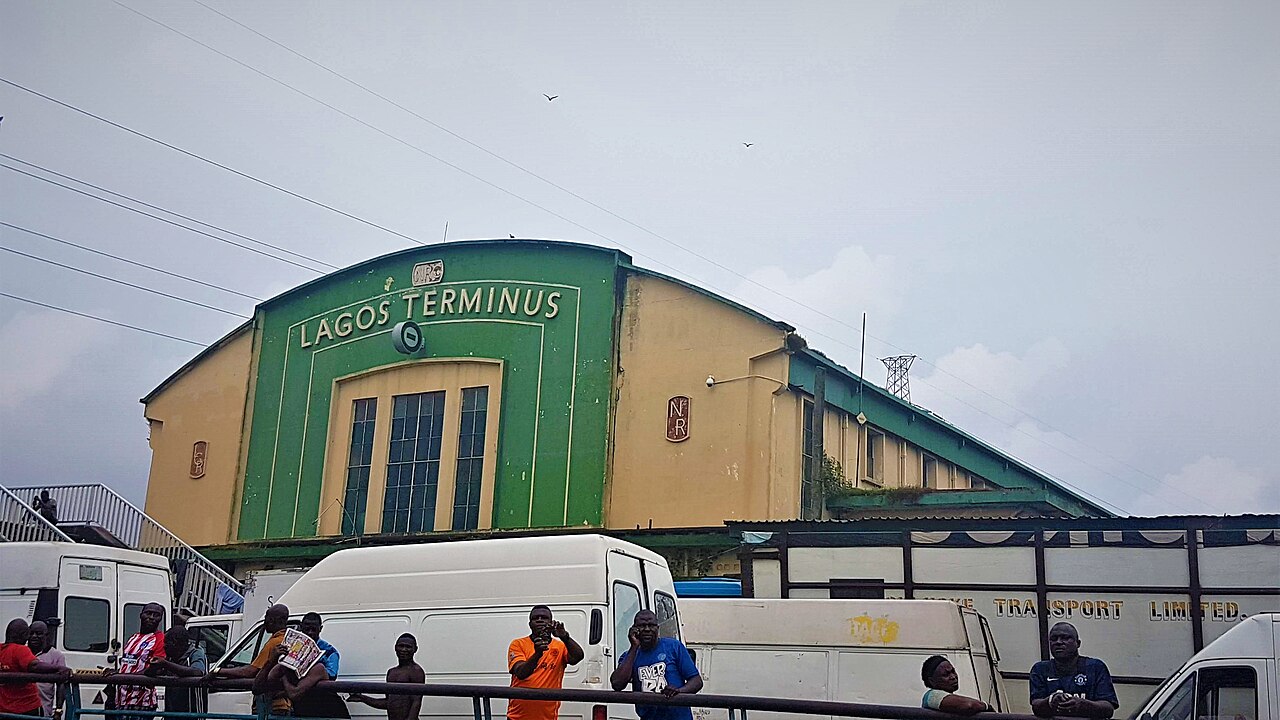 Commuters boarding a train at a modern railway station in Nigeria