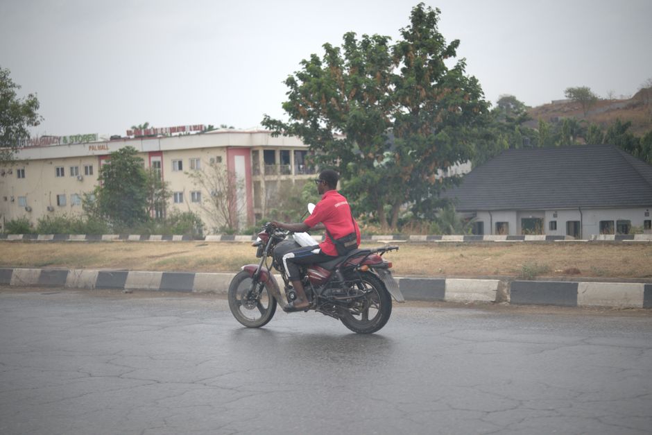 A bustling street view in Abuja representing Nigeria's economic landscape