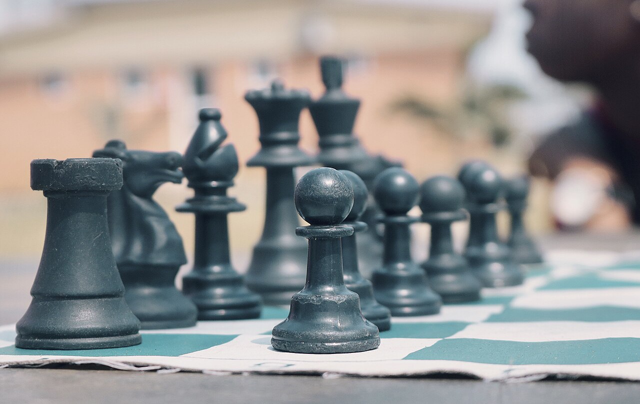 Young Nigerian children playing chess during a community tournament in Lagos