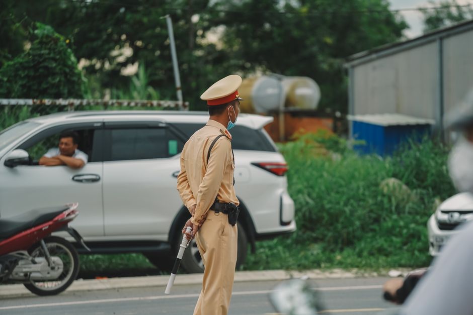 Vehicle inspection officers monitoring traffic on a Nigerian road