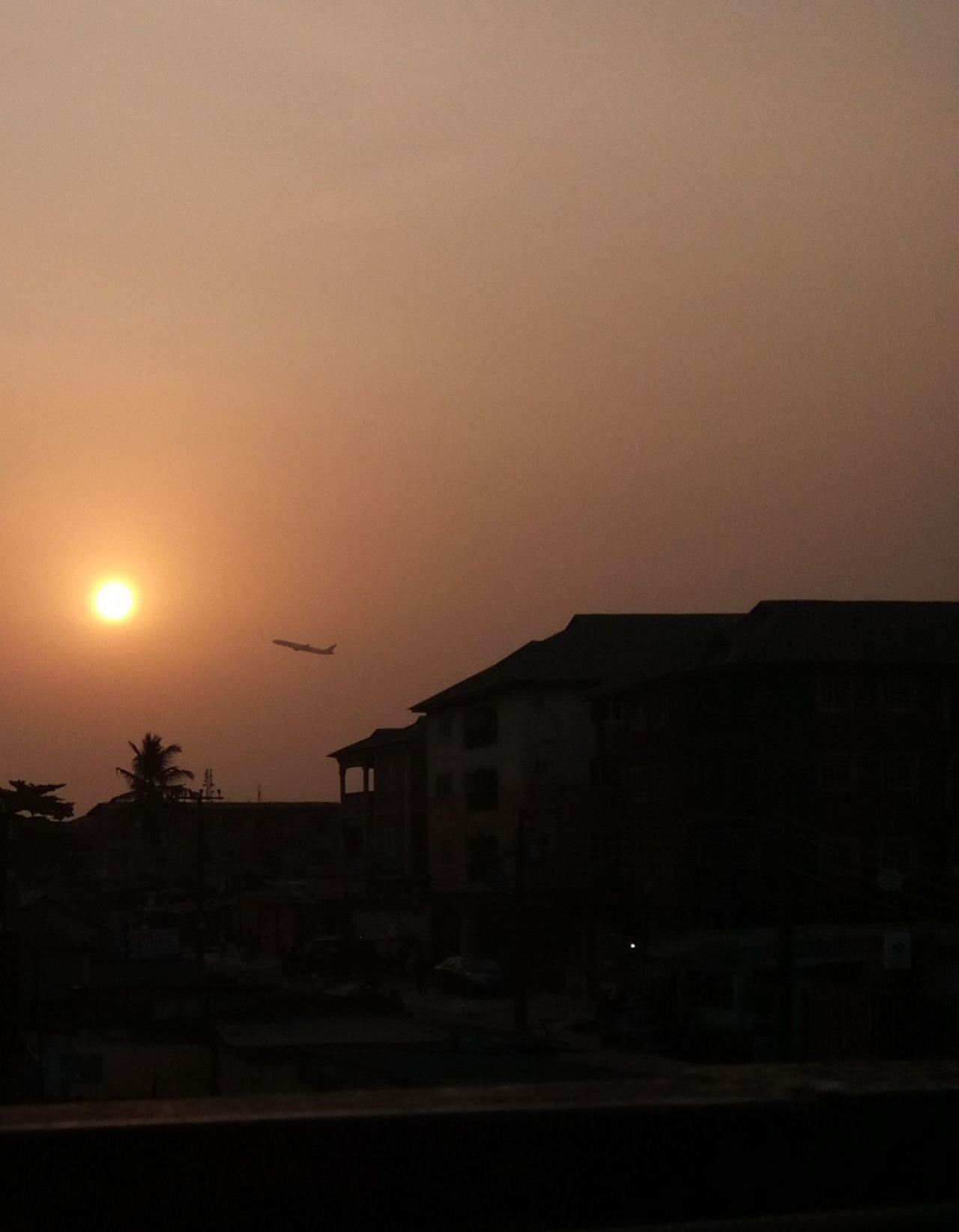 Commercial airplane taxing on the tarmac at a major Nigerian airport