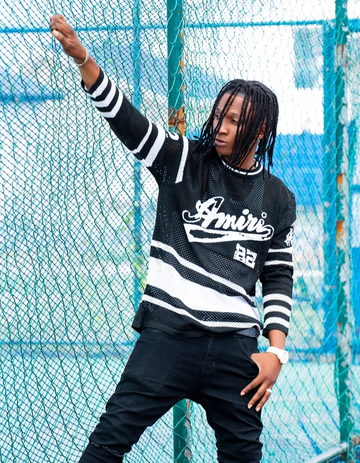 Afrobeats star performing on stage in Lagos