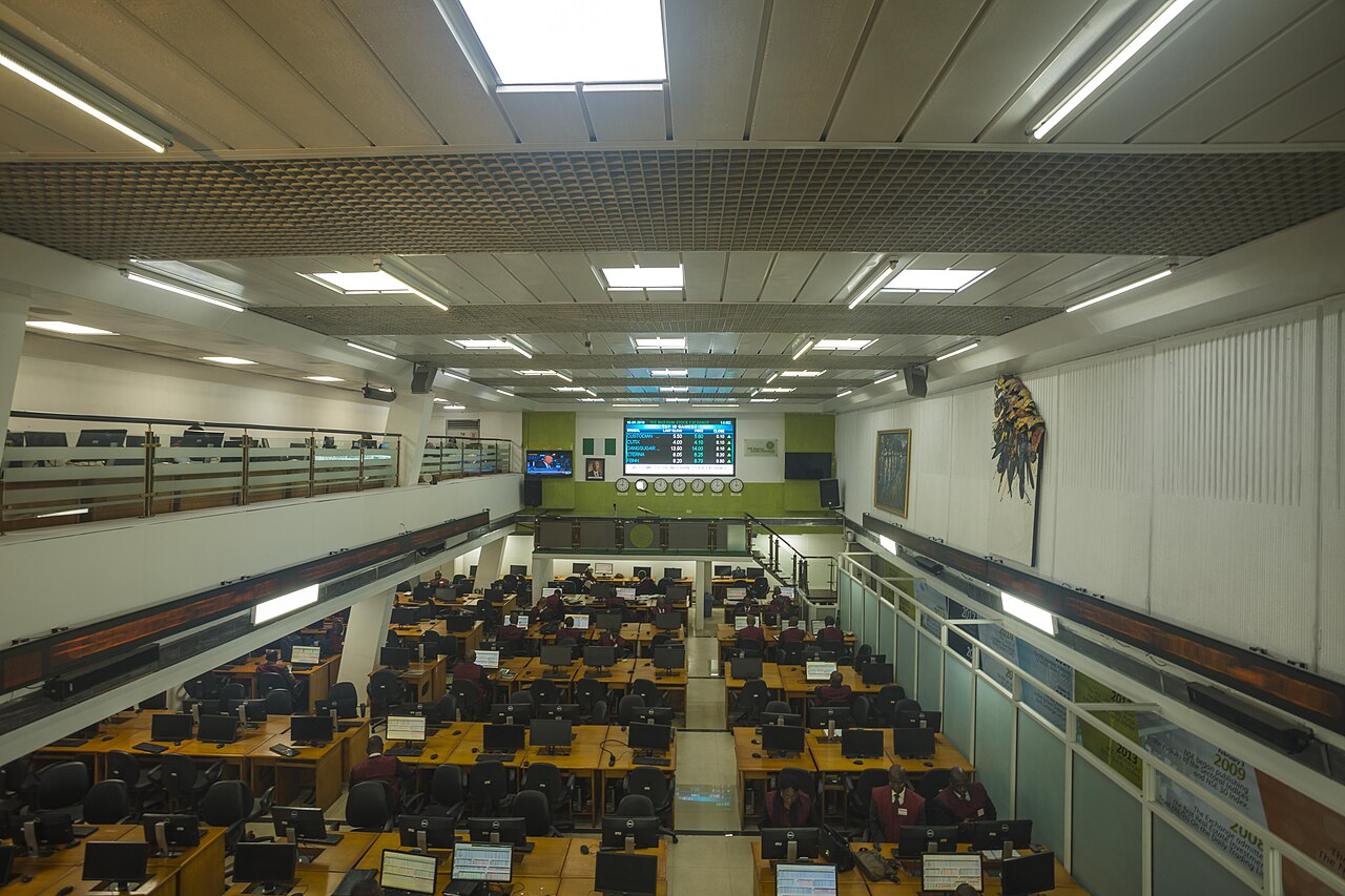Trading floor of the Nigerian Exchange in Lagos showing stock market data.